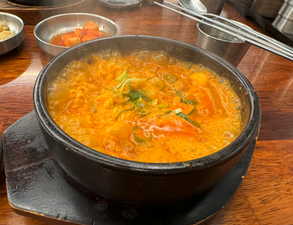 Main Menu Budae jjigae is a pork soup 돼지국밥